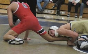 Franklin Regionals Chase Smith drags down Moons Cael Yanek last month. (Paul Schofield | TribLive)