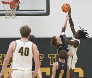 South Alleghenys Fischer Ielase fouls Seton LaSalles DayVaughn Williams on Tuesday. (Chaz Palla | TribLive)