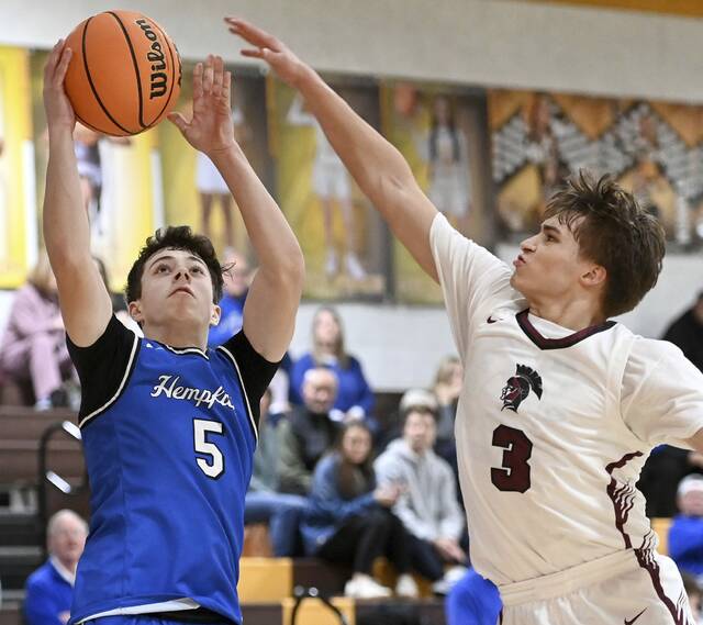 Hempfields Trevor Donsen drives to the basket against Greensburg Centrals Lucca Denis on Dec. 29, 2025, at Greensburg Salem. (Christopher Horner | TribLive)