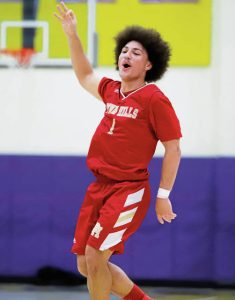 Calix Clark celebrates making a 3-pointer during the second half of Penn Hills 67-39 win over Plum on Jan. 6. (Josh Rizzo | For TribLive)