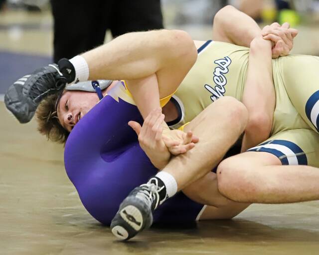 Franklin Regionals Michael Ruane (top) fights for position against Plums Owen Campbell during their 152-pound bout Wednesday at Franklin Regional. (Josh Rizzo | For TribLive)
