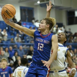 Chartiers Valleys Julian Semplice scores past Lincoln Parks Antonio Goodman on Wednesday in Midland. (Christopher Horner | TribLive)