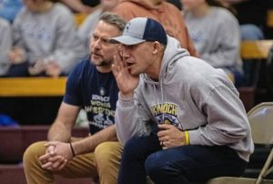 Logan Downes coaches the Knoch girls wrestling team during a match in the 2025-26 season. (Courtesy of Knoch wrestling boosters)