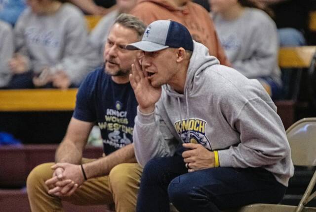 Logan Downes coaches the Knoch girls wrestling team during a match in the 2025-26 season. (Courtesy of Knoch wrestling boosters)