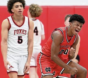 New Castle’s Damian Harrison celebrates next to Fox Chapel’s John Rehak after hitting a 3-pointer during the fourth quarter on Friday, Jan. 9, 2026 at Fox Chapel. (Christopher Horner | TribLive)