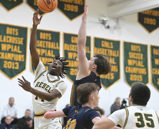Seton LaSalles Jaleel Wright shoots as South Alleghenys Jake Uher defends Tuesday. (Chaz Palla | TribLive)