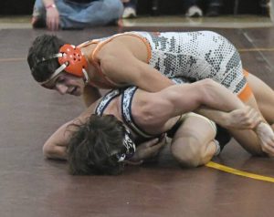 Latrobe freshman Marco Angelicchio takes down Kiski Area sophomore Paxton Newell in the 144-pound semifinal at the WCCA tournament Saturday. (Paul Schofield | TribLive)