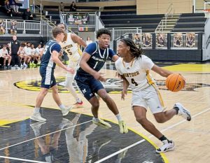 Montour's Brandon Bennett (4) drives on Montour's Dionte Fleming on Jan. 10, 2026, at Montour. (Antonio Rossetti | For TribLive)