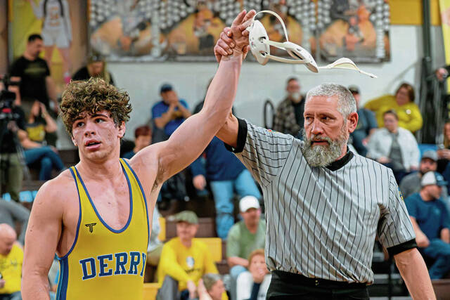 Derry's Mason Horwat (left) has his hand raised after winning his third WCCA wrestling title on Saturday, Jan. 10, 2026, at Greensburg Salem. (Andrew Palla | For TribLive)