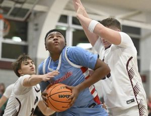 Greensburg Central Catholics Lucca Denis and James Botti defend on Jeannettes Markus McGowan on Jan. 9, 2026 at Greensburg Central Catholic High School. (Chaz Palla | TribLive)