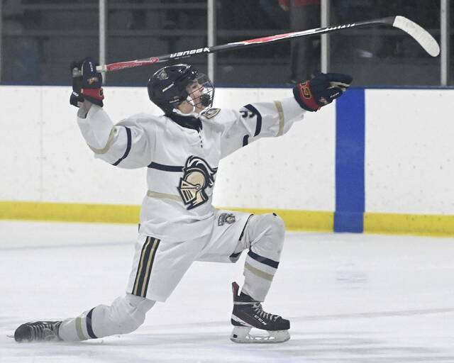 Knoch’s Tyson Voloch celebrates after scoring against Burrell on Monday, Dec. 15, 2025, at Frozen Pond. (Christopher Horner | TribLive)