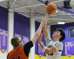 Knoch's Roman DeFelice (13) attempts a shot over Latrobe's Michael Monios on Friday, Dec. 26, 2025, at Plum. (Andrew Palla | For TribLive)
