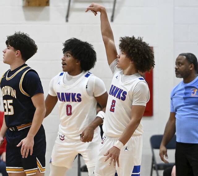 Jeannettes Jayce Powell watches his 3-pointer during the fourth quarter against Norwin on Dec. 20, 2025. (Christopher Horner | TribLive)
