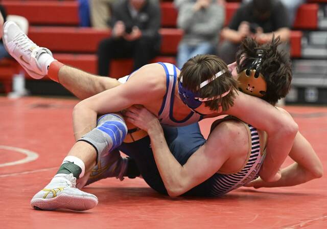 Connellsvilles Kai Vielma works to pin Franklin Regionals Nico Sarnic at 139 pounds during the 2025 WPIAL Class 3A team championships. (Chaz Palla | TribLive)