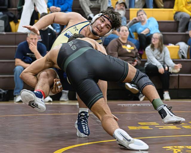 Belle Vernon's Elijah Brown (front) completes a takedown on Kiski Area's Cooper Roscosky (back) on Saturday, Jan. 10, 2026, at Greensburg Salem. (Andrew Palla | For TribLive)