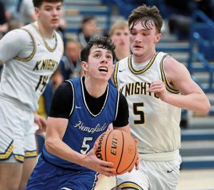 Hempfields Trevor Donsen, who led all scorers with 20 points, drives to the basket past Norwins Alex Graney during their game on Tuesday at Norwin. (Christopher Horner | TribLive)