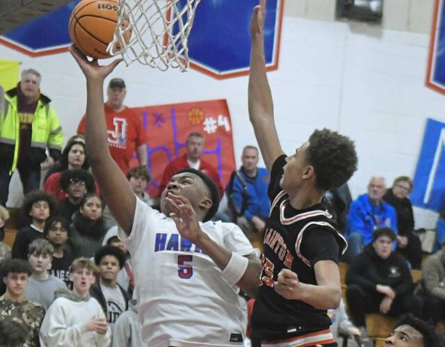 Jeannettes Markus McGowan hits a layup during a Section 1-2A game against Clairton on Tuesday. (Paul Schofield | TribLive)