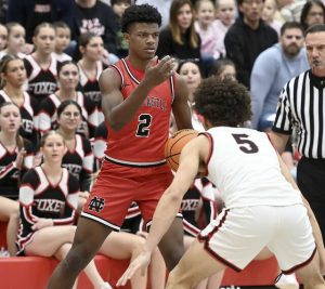 New Castles Damian Harrison works against Fox Chapels John Rehak on Jan. 9 at Fox Chapel. (Christopher Horner | TribLive)