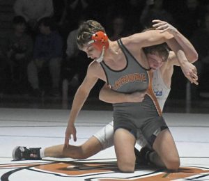 Latrobes Logan Peagler tries to escape the hold of Hempfields Murphy Sheridan at 139 pounds Wednesday. (Paul Schofield | TribLive)