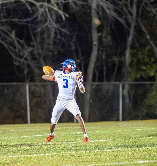 Jeannette quarterback Kymone Brown heaves a pass downfield against Bentworth during a WPIAL Class A first-round playoff game. (Floyd Kish | Mon Valley Independent)
