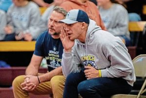 Logan Downes coaches the Knoch girls wrestling team during a match in the 2025-26 season. (Courtesy of Knoch wrestling boosters)