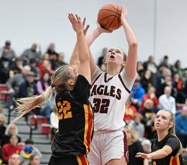 Oakland Catholics Josie Fontana scores over North Catholics Sarah Loughry last season. (Chaz Palla | TribLive)
