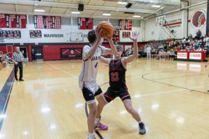 Southmorelands Noah Felentzer guards Elizabeth Forwards Daniel Spence on Friday. (Floyd Kish | Mon Valley Independent)