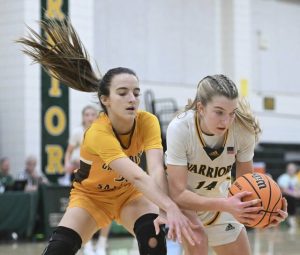 Penn-Traffords Hanna Weishaar grabs a loose ball from Greenburg Salems Vienna Jevicky on Friday. (Chaz Palla | TribLive)