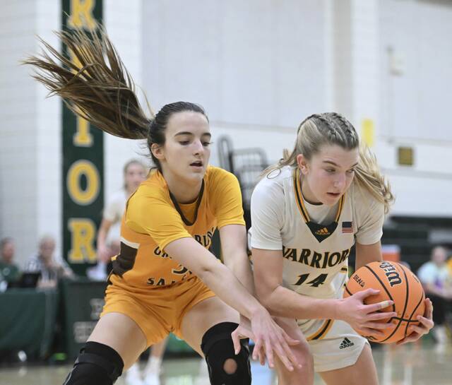 Penn-Traffords Hanna Weishaar grabs a loose ball from Greenburg Salems Vienna Jevicky on Friday. (Chaz Palla | TribLive)