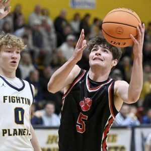 Moons Jackson Bauman scores past Mars Adam Petcash on Jan. 5. (Christopher Horner | TribLive)