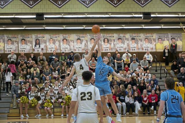 Deer Lakes Luca Mangieri (4) and Burrells Gavyn Orr jump to open Friday nights section game. (Brennan Valladares | For TribLive)