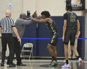Gateways Jacob Settles celebrates with head coach Vern Benson after Settles hit a 3-pointer to take a lead over Franklin Regional on Dec. 19, 2025 at Franklin Regional High School. (Chaz Palla | TribLive)