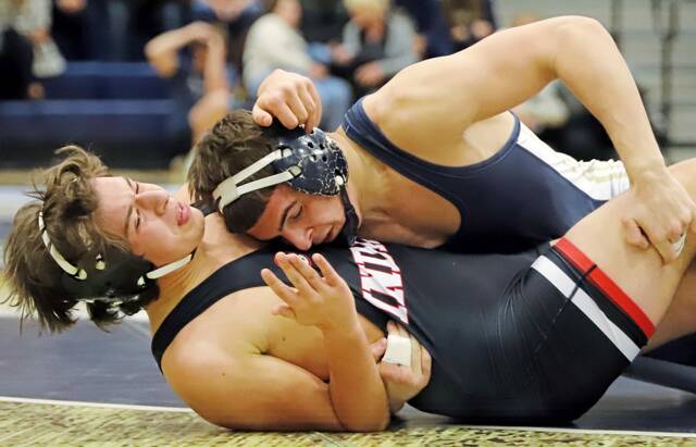 Kiski Areas Mario Hutcherson twists Indianas Jacob Snyder to the mat last month during their 189-pound match at Kiski Area High School. (Josh Rizzo | For TribLive)