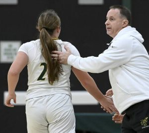 Penn-Trafford head coach Chuck Fontana greets Torrie DeStefano at the bench during their game against Latrobe on Tuesday, Dec. 16, 2025, at Penn-Trafford. (Christopher Horner | TribLive)