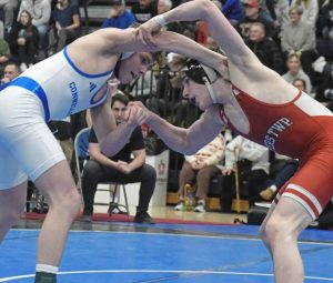 Connellsvilles Tommy Gretz (left) and Peters Townships Nicholas McGarrity battle for control Feb. 22, 2025. (Paul Schofield | TribLive)