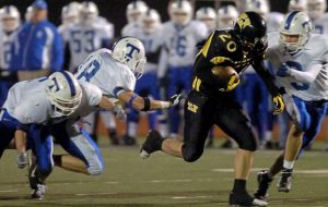 Thomas Jefferson's Brian Baldrige (20) rambles through the Trinity defense for a long gain during the second quarter Oct. 13, 2006. (Christopher Horner | TribLive)