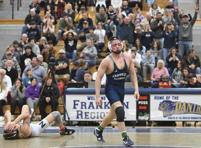 Franklin Regionals Cohen Buccicone pins Norwins Evan Suedhoff during the 160-pound bout Wednesday. (Chaz Palla | TribLive)