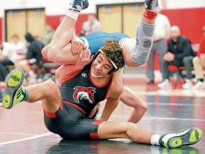 Fox Chapels Calyx Kimbrough attempts to maintain position during a scramble with Kiski Areas Tyler Bollinger in their 160-pound match Wednesday night at Fox Chapel. Kimbrough won 7-4. (Josh Rizzo | For TribLive)
