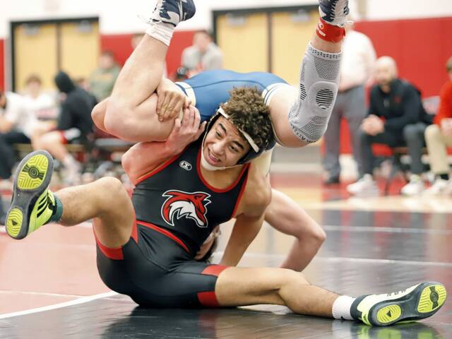 Fox Chapel's Calyx Kimbrough attempts to maintain position during a scramble with Kiski Area's Tyler Bollinger during their 160-pound match Wednesday night at Fox Chapel. Kimbrough won 7-4. (Josh Rizzo | For TribLive)