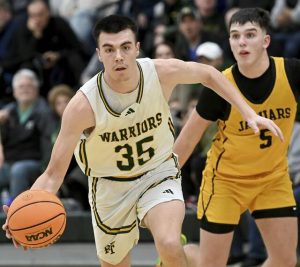 Penn-Trafford’s Zach Feldman drives past Thomas Jefferson’s Kane Eggerton during their game on Wednesday, Jan. 21, 2026, in Harrison City. (Christopher Horner | TribLive)