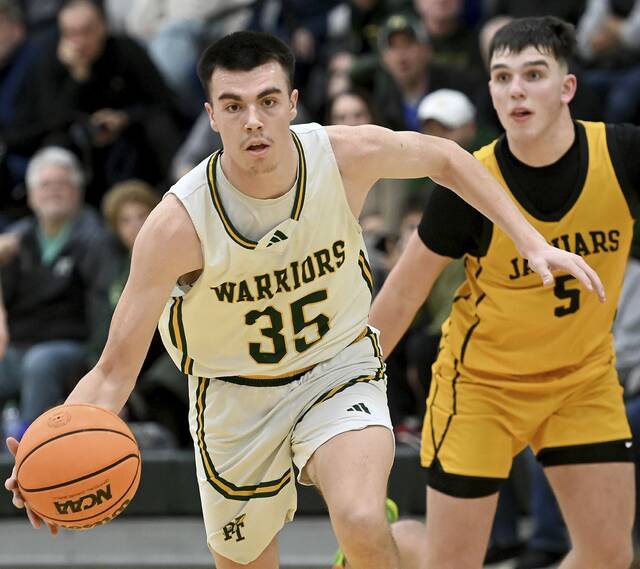 Penn-Trafford’s Zach Feldman drives past Thomas Jefferson’s Kane Eggerton during their game on Wednesday, Jan. 21, 2026, in Harrison City. (Christopher Horner | TribLive)