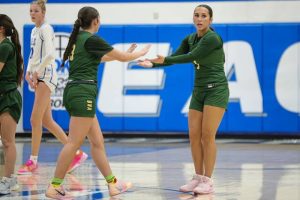 Belle Vernons Lyla McConnell and Emerson LaCarte celebrate during a game against South Park on Thursday. (Jeff Helsel | Mon Valley Independent)