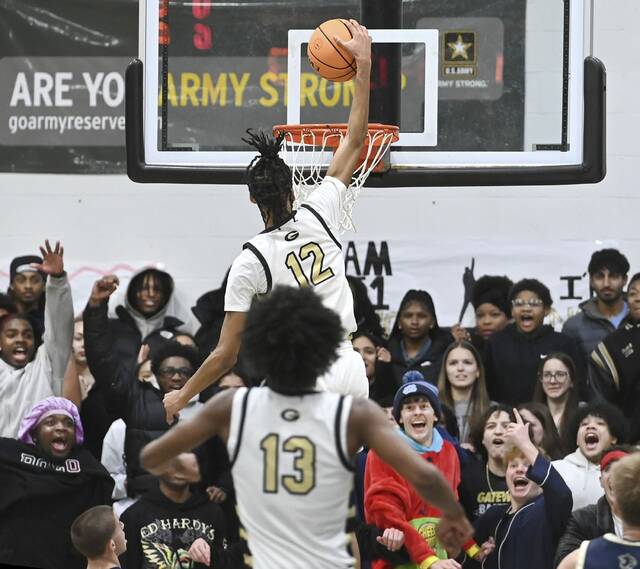 Gateway’s Mykel Bruce-McCrommon dunks in front of the student section against Franklin Regional on Friday, Jan. 23, 2026, in Monroeville. (Christopher Horner | TribLive)