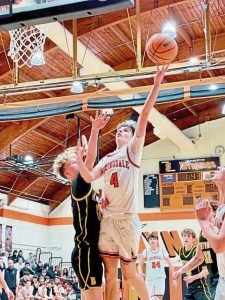 Springdales Robbie Simmen drives to the basket against Bentworths Levi Urcho during their game Friday. (Antonio Rossetti | For TribLive)