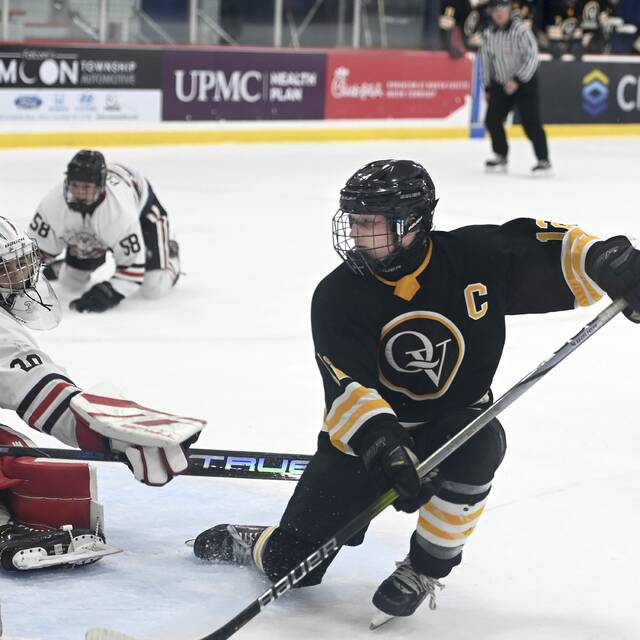 Quaker Valleys Jace Vasbinder watches his goal against Moon on Monday, Nov. 24, 2025, at RMU Island Sports Center. (Christopher Horner | TribLive)