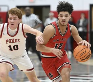 New Castle’s Kai Cox drives past Fox Chapel’s Anderson Dockey during their game on Friday, Jan. 9, 2026 at Fox Chapel. (Christopher Horner | TribLive)
