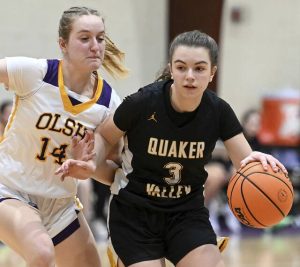 Quaker Valley’s Keira Watson drives past OLSH’s Leah Parker during their game on Thursday, Jan. 22, 2026, in Coraopolis. (Christopher Horner | TribLive)