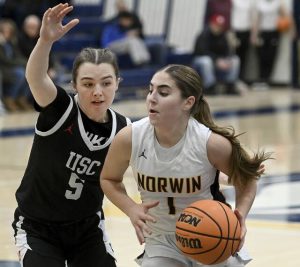 Norwins Giuliana Giannikas drives past Upper St. Clairs Ryan Prunzik on Tuesday. (Christopher Horner | TribLive)