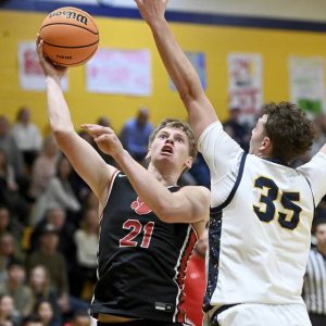 Moons Hunter Kopay scores against Mars Ben Detisch on Jan. 5. (Christopher Horner | TribLive)