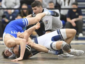 Norwins Brooks Blasko pins Trinitys Jacob Wright in the 139-pound bout during the WPIAL Class 3A team wrestling quarterfinals Wednesday. (Chaz Palla | TribLive)